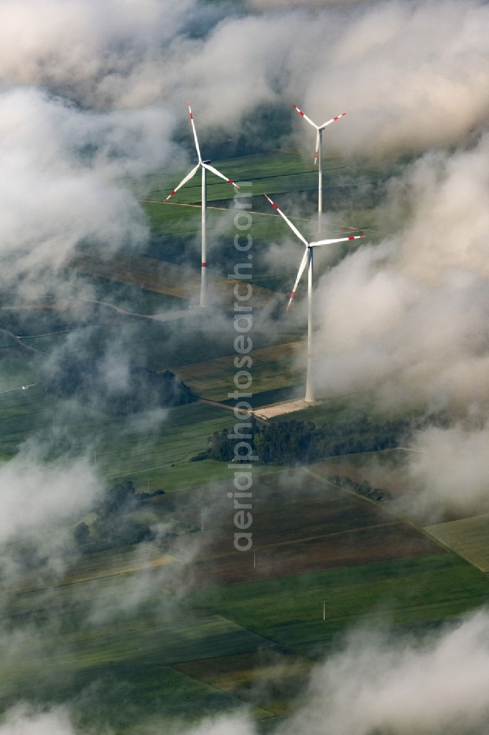 Titting from the bird's eye view: Weather-induced wind energy installations embedded in a cloud layer in Titting in the state Bavaria, Germany