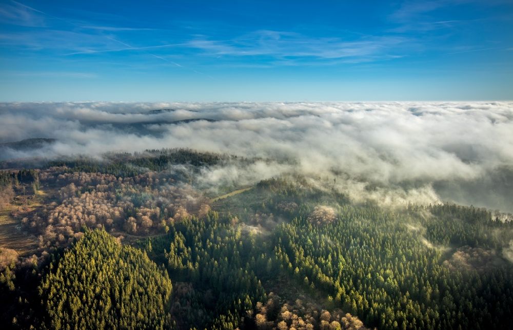 Lengenbeck from the bird's eye view: Weather with layered fog cover over forest areas in Lengenbeck in the state North Rhine-Westphalia, Germany
