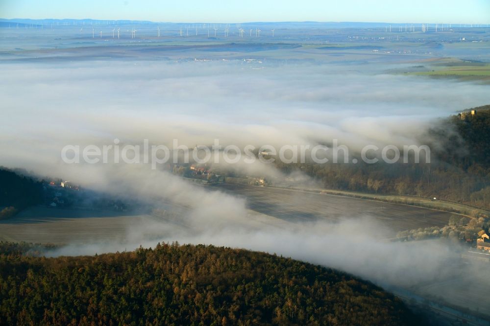 Oldisleben from the bird's eye view: Weather with layered fog cover over forest areas in Oldisleben in the state Thuringia, Germany