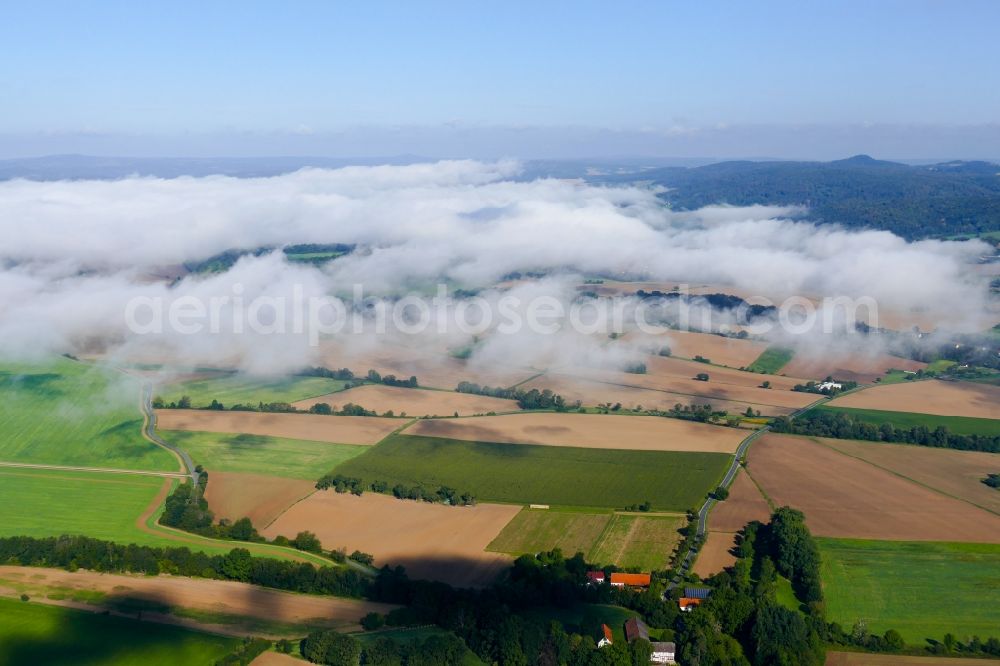Hedemünden from the bird's eye view: Weather with layered fog cover in Hedemuenden in the state Lower Saxony, Germany