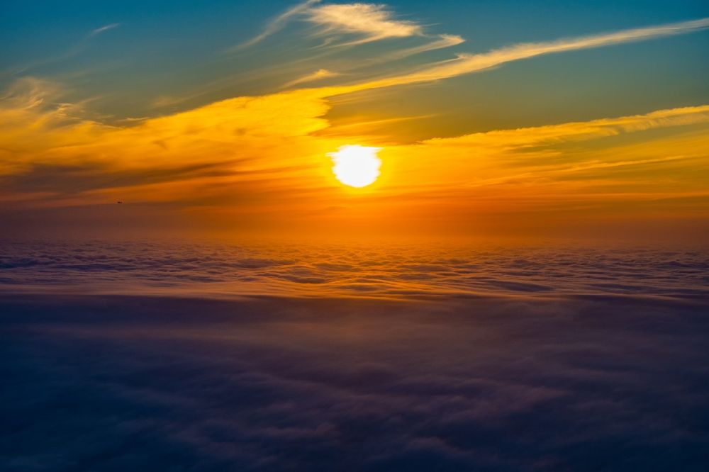 Tangstedt from above - Weather situation with solar radiation above the clouds Sunrise in Tangstedt in the state Schleswig-Holstein, Germany