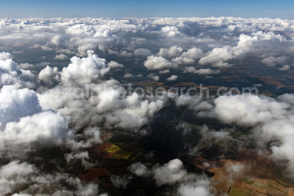Römhild from above - Weather situation with solar radiation from openings of the cloud cover in Roemhild in the state Thuringia, Germany