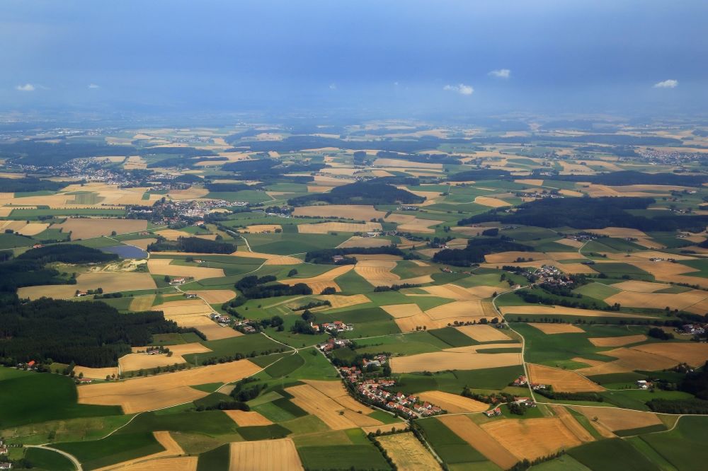 Kirchberg from above - Weather conditions with cloud formation and thunderstorm promise rain in the dry agricultural landscape at Kirchberg in the state Bavaria, Germany