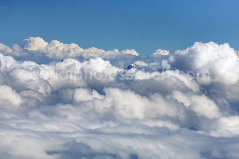 Aerial photograph Höfen - Weather conditions with cloud formation above the mountain peaks of the Alps in Hoefen in Tirol, Austria