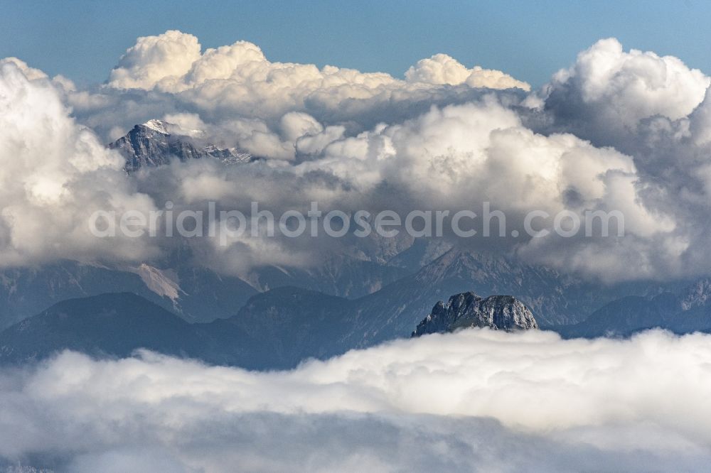 Höfen from the bird's eye view: Weather conditions with cloud formation above the mountain peaks of the Alps in Hoefen in Tirol, Austria