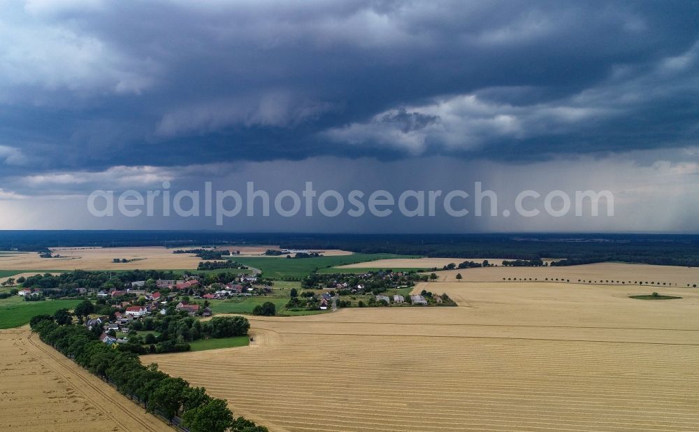Aerial image Petersdorf - Weather conditions with cloud formation an approaching rainy area over fields in Petersdorf in the state Brandenburg, Germany