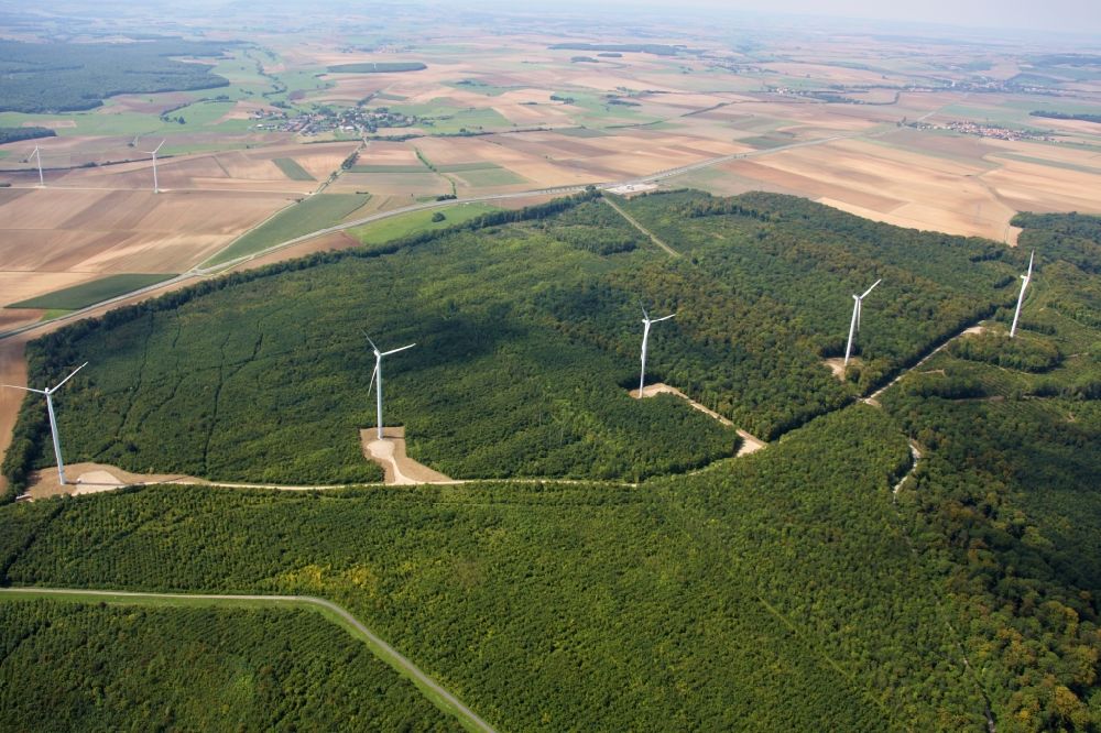 Amelecourt from the bird's eye view: Wind energy plants (WEA) with wind power plants of Iberdrola SA in a forest area in Amelecourt in Grand Est, France