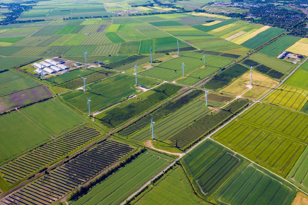 Bosbüll from the bird's eye view: Wind turbine windmills on a field in Bosbuell in the state Schleswig-Holstein, Germany