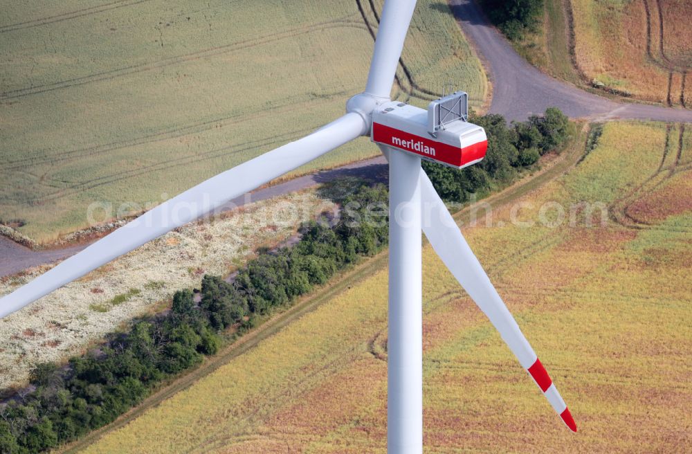 Bucha from above - Wind turbine windmills on a field on street Dorfstrasse in Bucha in the state Thuringia, Germany