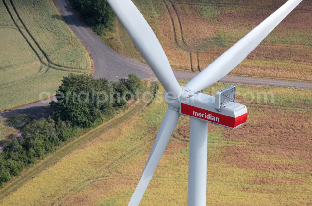Bucha from the bird's eye view: Wind turbine windmills on a field on street Dorfstrasse in Bucha in the state Thuringia, Germany