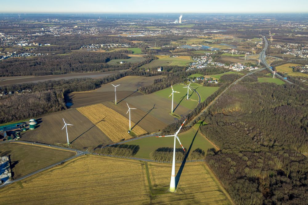 Mengede from the bird's eye view: Wind turbine windmills on a field in Mengede in the state North Rhine-Westphalia, Germany