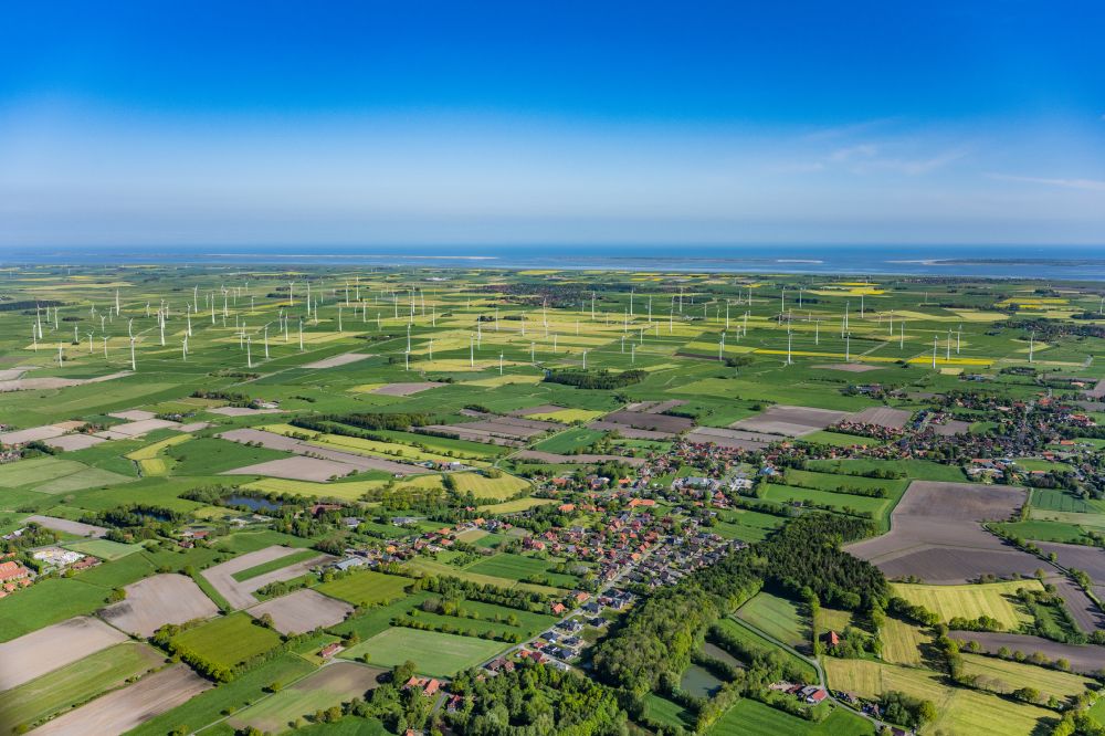 Schweindorf from above - Wind turbine windmills on a field in Schweindorf in the state Lower Saxony, Germany