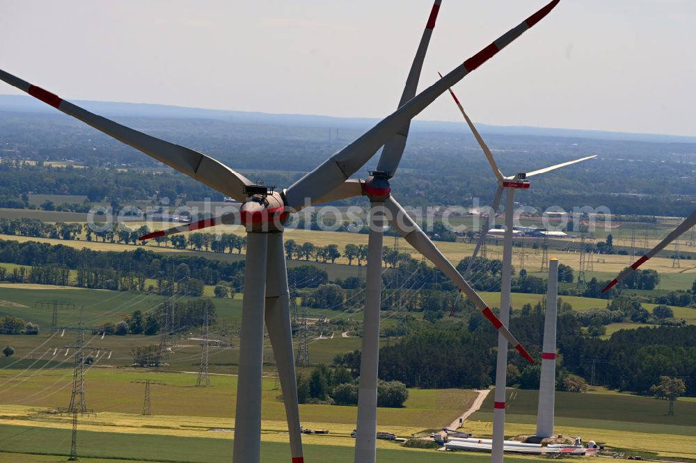 Seefeld-Löhme from the bird's eye view: Wind turbine windmills on a field in Seefeld-Loehme in the state Brandenburg, Germany