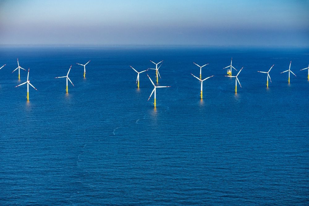 Aerial image Butjadingen - Wind turbines of the offshore wind farm on the water surface of North Sea in Nordergruende in the state Lower Saxony, Germany