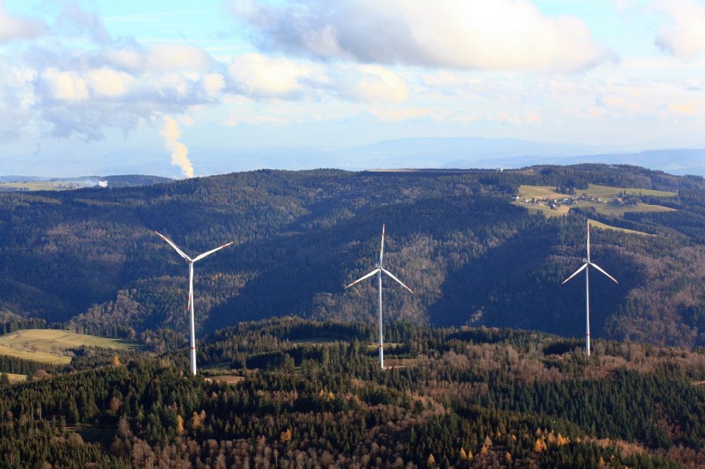 Aerial image Hasel - Wind turbines of the wind farm Glaserkopf in the Black Forest in Hasel in the state Baden-Wurttemberg, Germany. In the background the steam column of Swiss nuclear power plant Leibstadt KKL. Symbolic image for the controversial debate of nuclear power versus renewable power