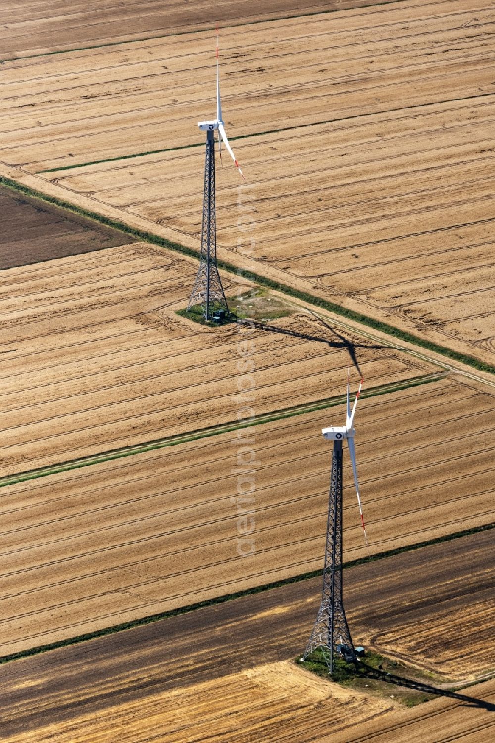 Neuenbrook from the bird's eye view: Wind turbine windmills on a field in Neuenbrook in the state Schleswig-Holstein, Germany