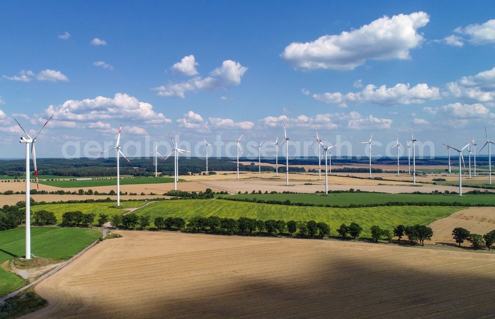 Petersdorf from the bird's eye view: Wind turbine windmills on a field in Petersdorf in the state Brandenburg, Germany