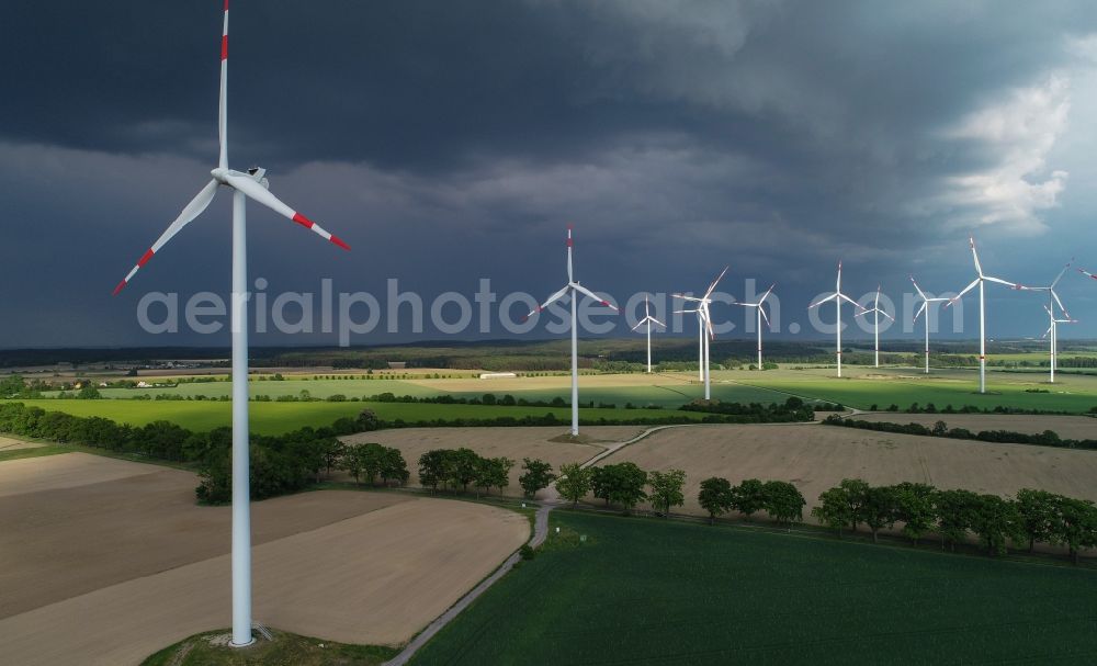 Sieversdorf from the bird's eye view: Wind turbine windmills on a field in Sieversdorf in the state Brandenburg, Germany