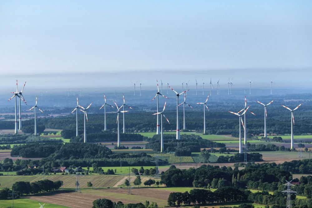 Aerial photograph Deinste - Wind turbines (WEA) - embedded windmill in the morning mist, on to the Stade Helmste in the state of Lower Saxony, Germany