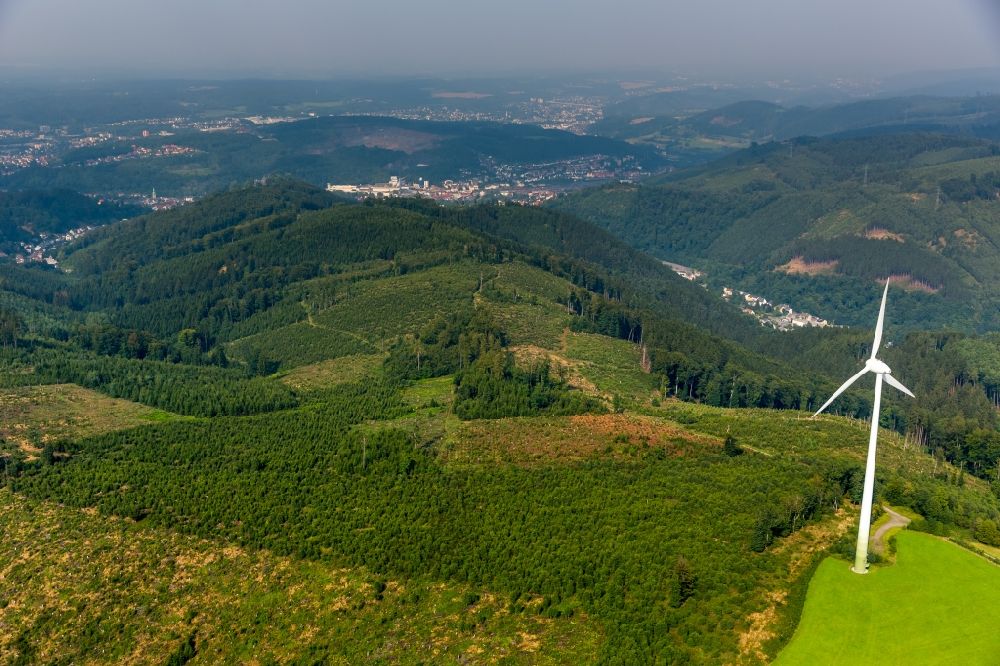 Aerial image Hagen - Wind turbine windmills on a hill in the South of Hohenlimburg in Hagen in the state of North Rhine-Westphalia. The wind wheel is located amidst forest and fields in the hilly landscape. View from the South towards Hohenlimburg