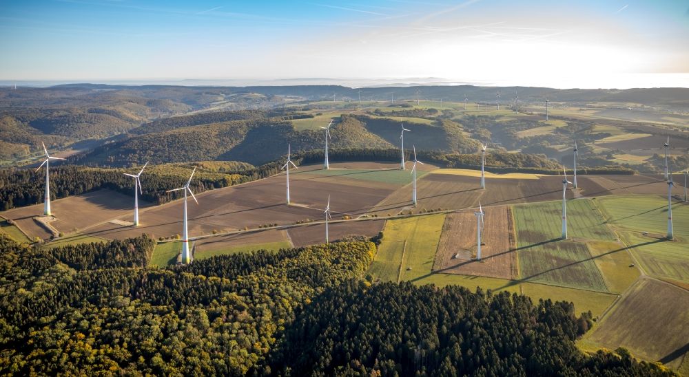 Lichtenau from the bird's eye view: Wind turbine windmills on agricultural fields in Lichtenau in the state North Rhine-Westphalia, Germany