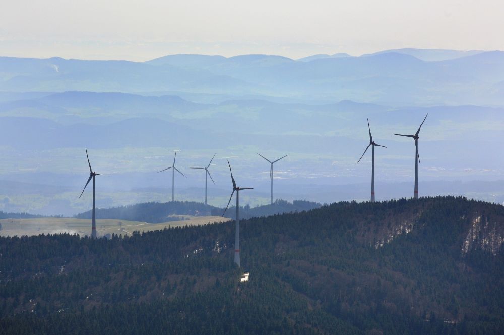 Schopfheim from above - Looking over the wind turbines of the wind farm Rohrenkopf in the Southern Black Forest at Schopfheim Gersbach, Baden-Wuerttemberg and the 3 wind turbines of the wind park Glaserkopf in Hasel
