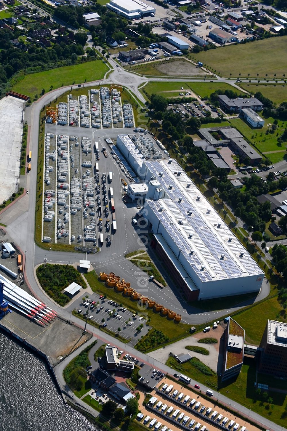 Aerial image Osterrönfeld - Wind turbine assembly and manufacturing plant in the industrial area of Max Boegl Fertigteilwerke GmbH & Co. KG in the district Stampfmuehle in Osterroenfeld in the state Schleswig-Holstein, Germany