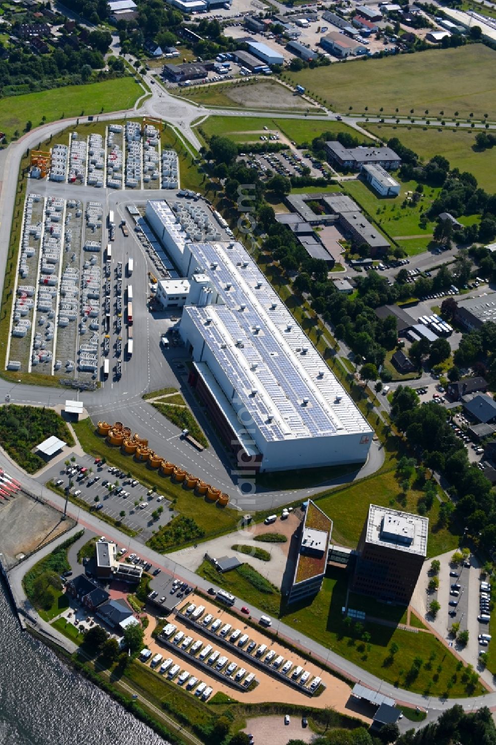 Aerial photograph Osterrönfeld - Wind turbine assembly and manufacturing plant in the industrial area of Max Boegl Fertigteilwerke GmbH & Co. KG in the district Stampfmuehle in Osterroenfeld in the state Schleswig-Holstein, Germany