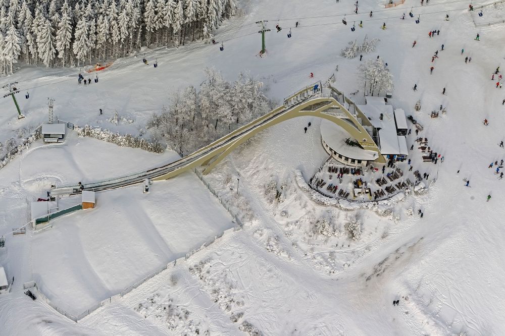 Aerial photograph Winterberg - Winter - View of the ski jump covered with snow St.Georg - jump and the apres-ski - rest stop in Winterberg in North Rhine-Westphalia NRW