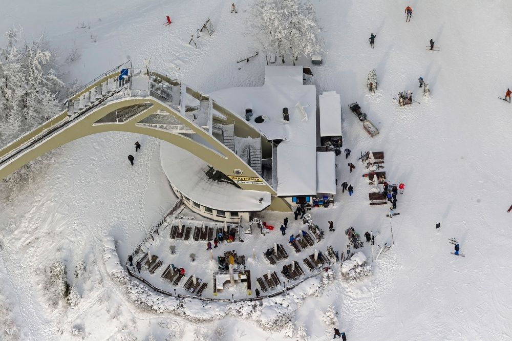 Winterberg from the bird's eye view: Winter - View of the ski jump covered with snow St.Georg - jump and the apres-ski - rest stop in Winterberg in North Rhine-Westphalia NRW
