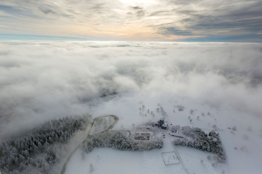 Aerial photograph Winterberg - Winter landscape of skiing downhill and skiing below the mountain Kahler Asten in Hochsauerlandkreis HSK in Winterberg in North Rhine-Westphalia NRW