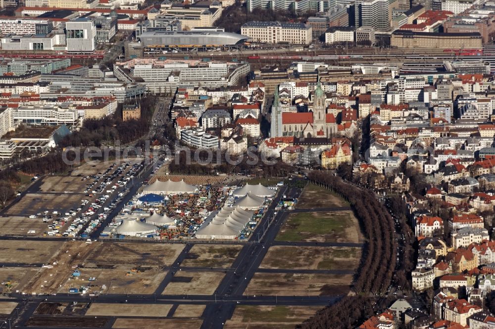 München from above - Winter Tollwood Festival with Christmas market at the Theresienwiese in Munich in Bavaria. The cultural events include theater, marketplace of ideas, world Salon