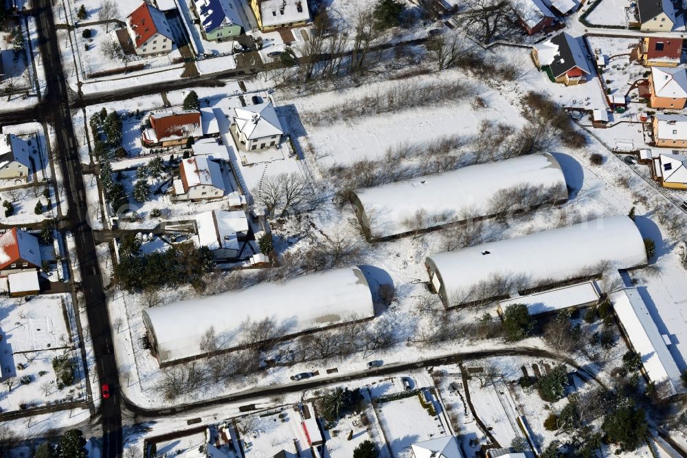 Berlin Kaulsdorf from above - Winter snow-covered ruins of old GDR multipurpose halls at the Bergedorf in Berlin - Kaulsdorf
