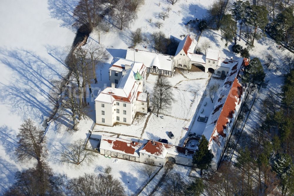 Berlin from above - Winter covered with snow castle Grunewald at Grunewaldsee in Berlin