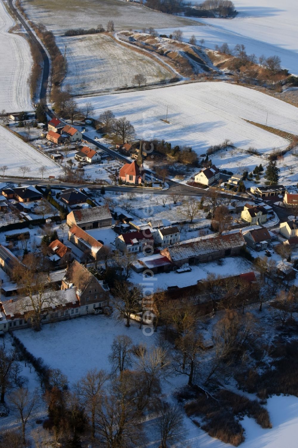 Aerial image Päwesin - Wintry snowy village view in Bagow in the state Brandenburg