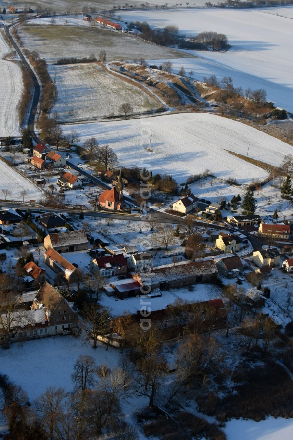 Aerial photograph Päwesin - Wintry snowy village view in Bagow in the state Brandenburg