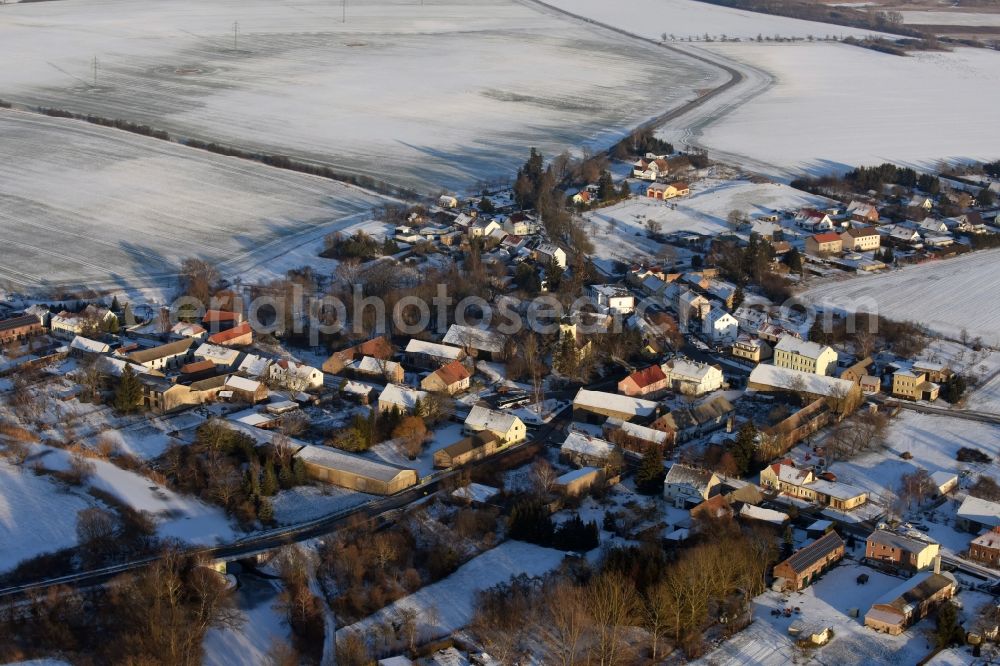 Päwesin from the bird's eye view: Wintry snowy village view in Paewesin in the state Brandenburg