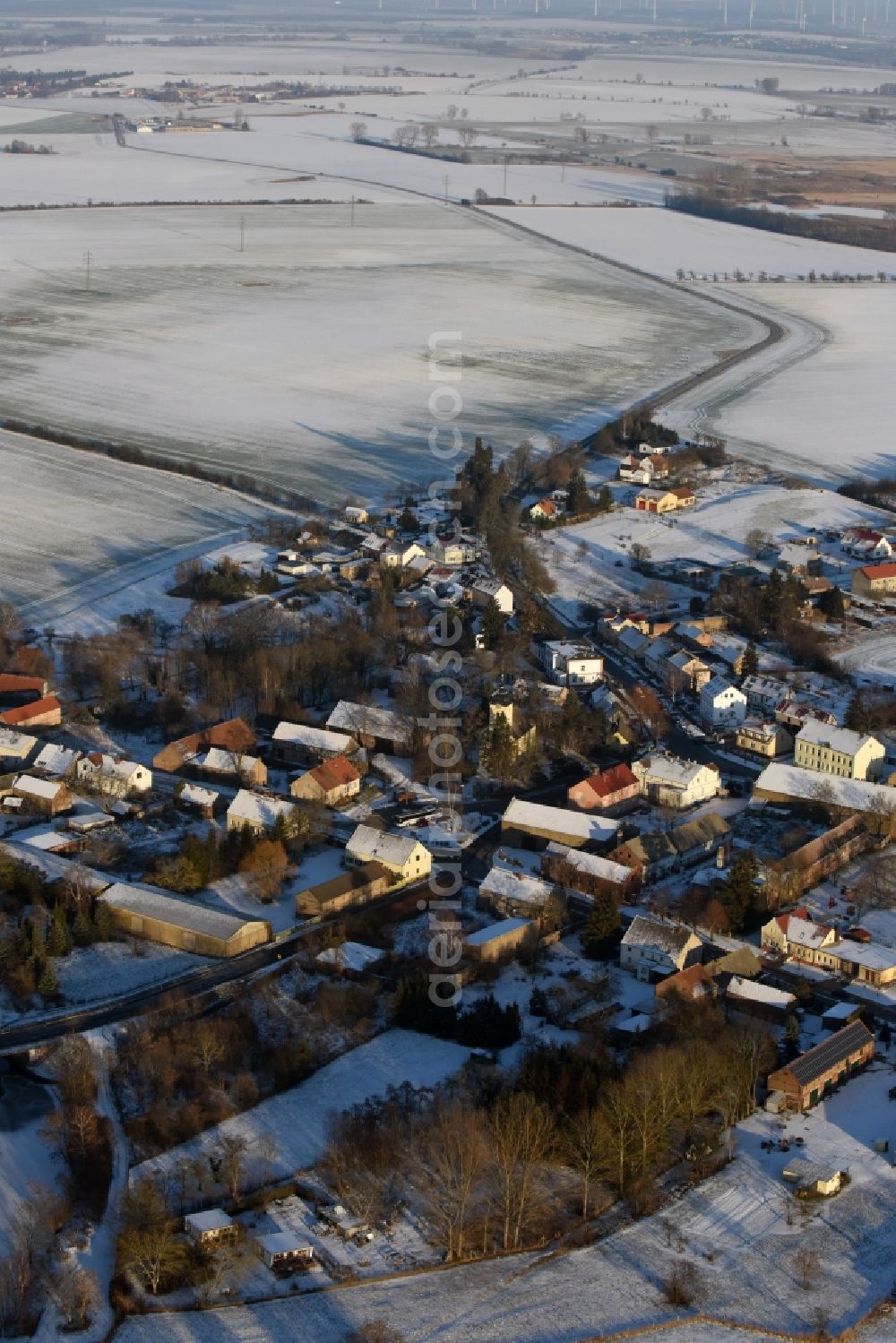 Aerial image Päwesin - Wintry snowy village view in Paewesin in the state Brandenburg