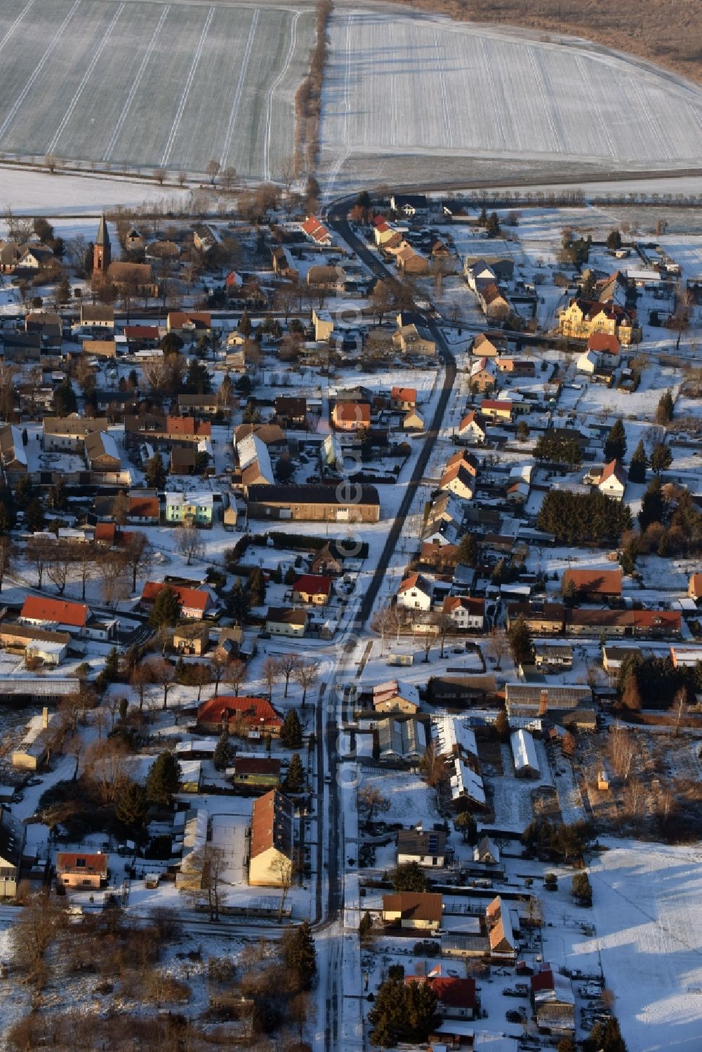 Nauen from the bird's eye view: Wintry snowy village view in Wachow in the state Brandenburg