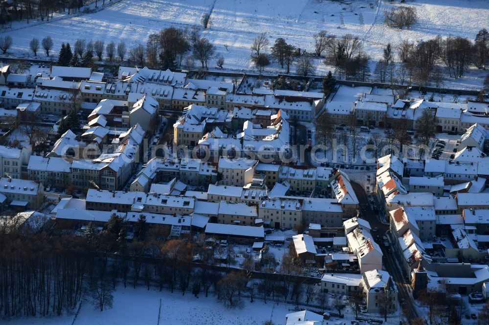 Altlandsberg from above - Wintry snowy Town View of the streets and houses of the residential areas in Altlandsberg in the state Brandenburg