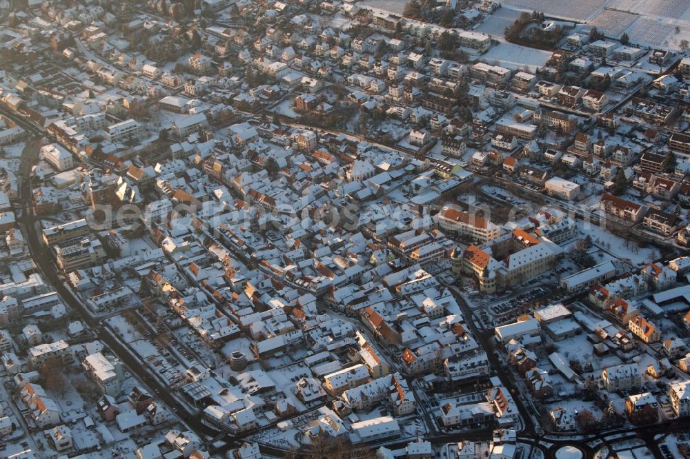 Bad Bergzabern from the bird's eye view: Wintry snowy townscape with streets and houses of the residential areas in Bad Bergzabern in the state Rhineland-Palatinate