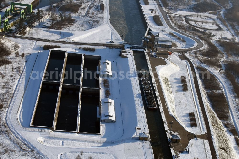 Aerial image Rothensee - Wintry snowy lock on the banks of the waterway Mittellandkanal and the Rothenseer channel in Rothensee in Saxony-Anhalt