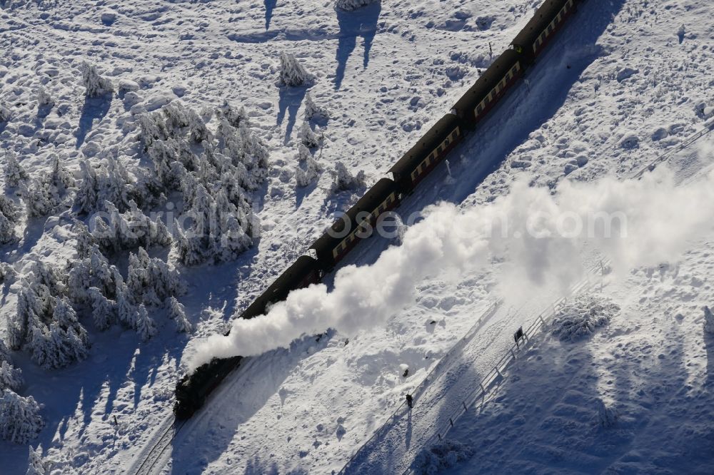 Aerial image Brocken - Wintry snowy railway Brockenbahn with a Mallet-Engine / steam locomotive / railcar, a narrow-gauge railway, during a trip at the Brocken mountain in Saxony-Anhalt