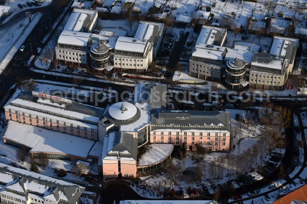 Magdeburg from above - Winterly snowy complex of the hotel building Ramada as well as the radio station radio SAW and the retirement home Pro Seniore in Hansapark in Magdeburg in the state Saxony-Anhalt