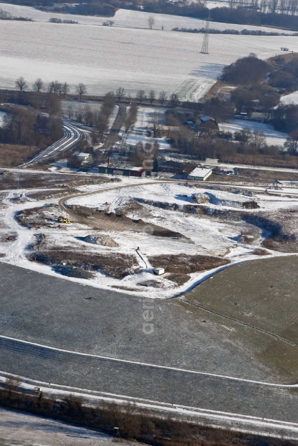 Ketzin from the bird's eye view: Wintry snowy site of heaped landfill in Ketzin in the state Brandenburg