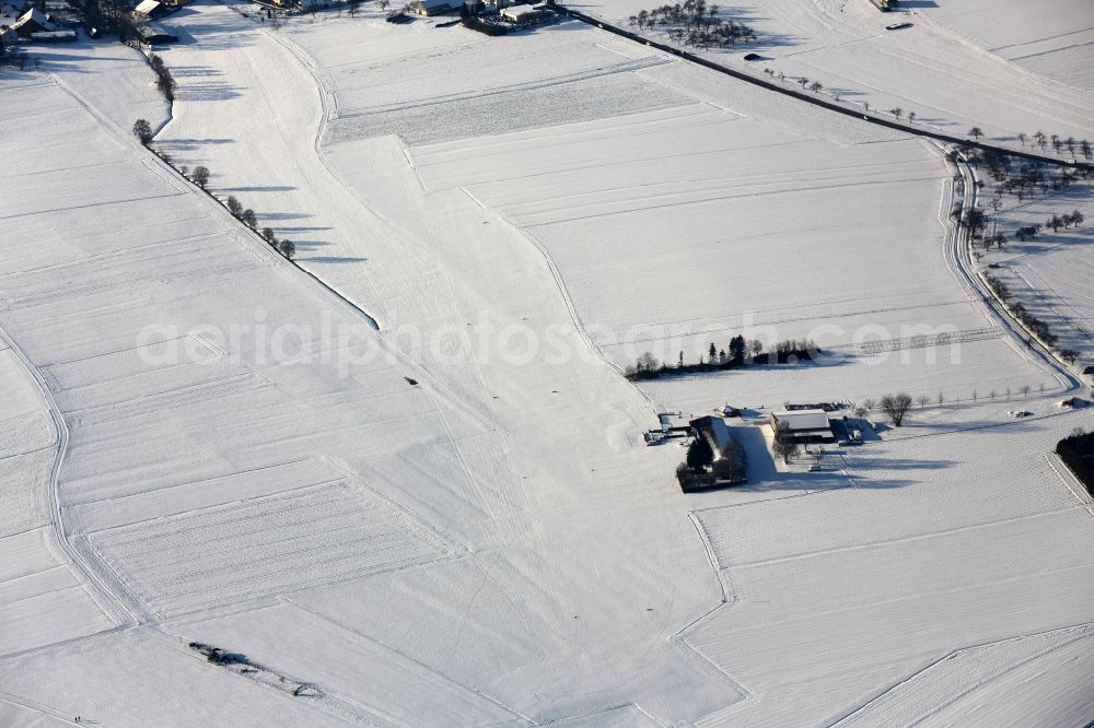 Backnang from above - Wintery snow-covered runway and environment - taxiway grounds of the airfield Luftsportverein Backnang- Heiningen e.V. Flugplatz an der Oberwiese in Backnang in the state Baden-Wuerttemberg