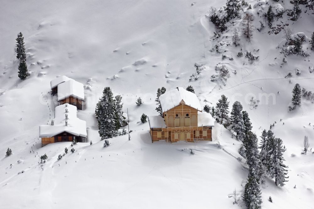 Aerial photograph Garmisch-Partenkirchen - Wintry snowy King's House on Schachen south of Garmisch-Partenkirchen in the rocks and mountains of the Wetterstein mountains in the state of Bavaria. The castle made of wood was built by Koenig Ludwig