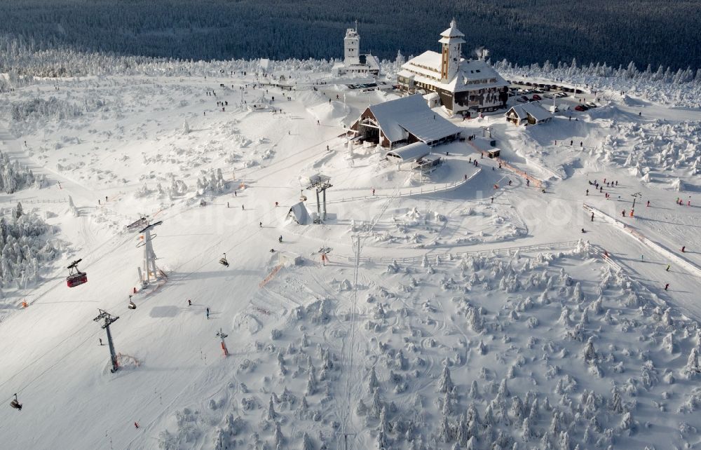 Kurort Oberwiesenthal from above - Wintry snowy mountain slope with downhill ski slope and cable car - lift on Fichtelberg in Kurort Oberwiesenthal in the state Saxony, Germany