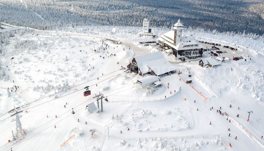 Kurort Oberwiesenthal from above - Wintry snowy mountain slope with downhill ski slope and cable car - lift on Fichtelberg in Kurort Oberwiesenthal in the state Saxony, Germany