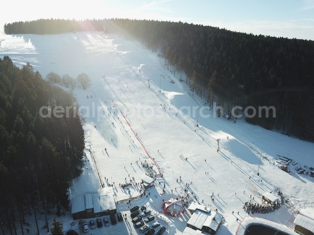 Steinach from above - Wintry snowy mountain slope with downhill ski slope and cable car - lift Ski Arena Silbersattel in Steinach in the state Thuringia, Germany